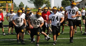 During a practice on Hollingsworth Field, members of the offensive line come out of a huddle. Because of a bye week, Gustavus had extra time to prepare for its season opener. <em>Sports Information</em>