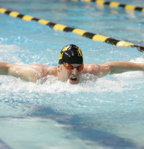 Senior Casey Enevoldsen swims full speed ahead in the Lund Natatorium.  Sports Information.