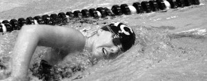 Sophomore Emma Nelson, who specializes in freestyle and breasktroke, practices her freestyle stroke in the Lund Natatorium.  Sports Information.
