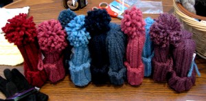 Hats knitted by Gustavus students for the children at Jump Start preschool. The students are part of the January Interim Experience class The Fabric of Life. Olivia Karns.