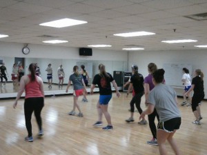 Participants in Hanna Engebretson’s kickboxing class work on improving their cardiovascular endurance and muscular strength. Zac Isaak 