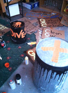 Students painted drums and signs to prepare to use at the Divest-Fest Rally today. Submitted