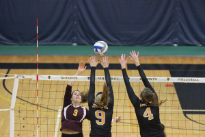 Becca Woodstra and Alyssa Taylor reaching over the net to block a spike against Concordia last year. Taylor, who has been part of the MIAC All-Conference team two years in a row, played an important role when the Gusties took down number one ranked Bethel University on Wednesday night.
