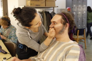 Olivia Brillantes works her make-up magic on Thomas to transform him into an old man.