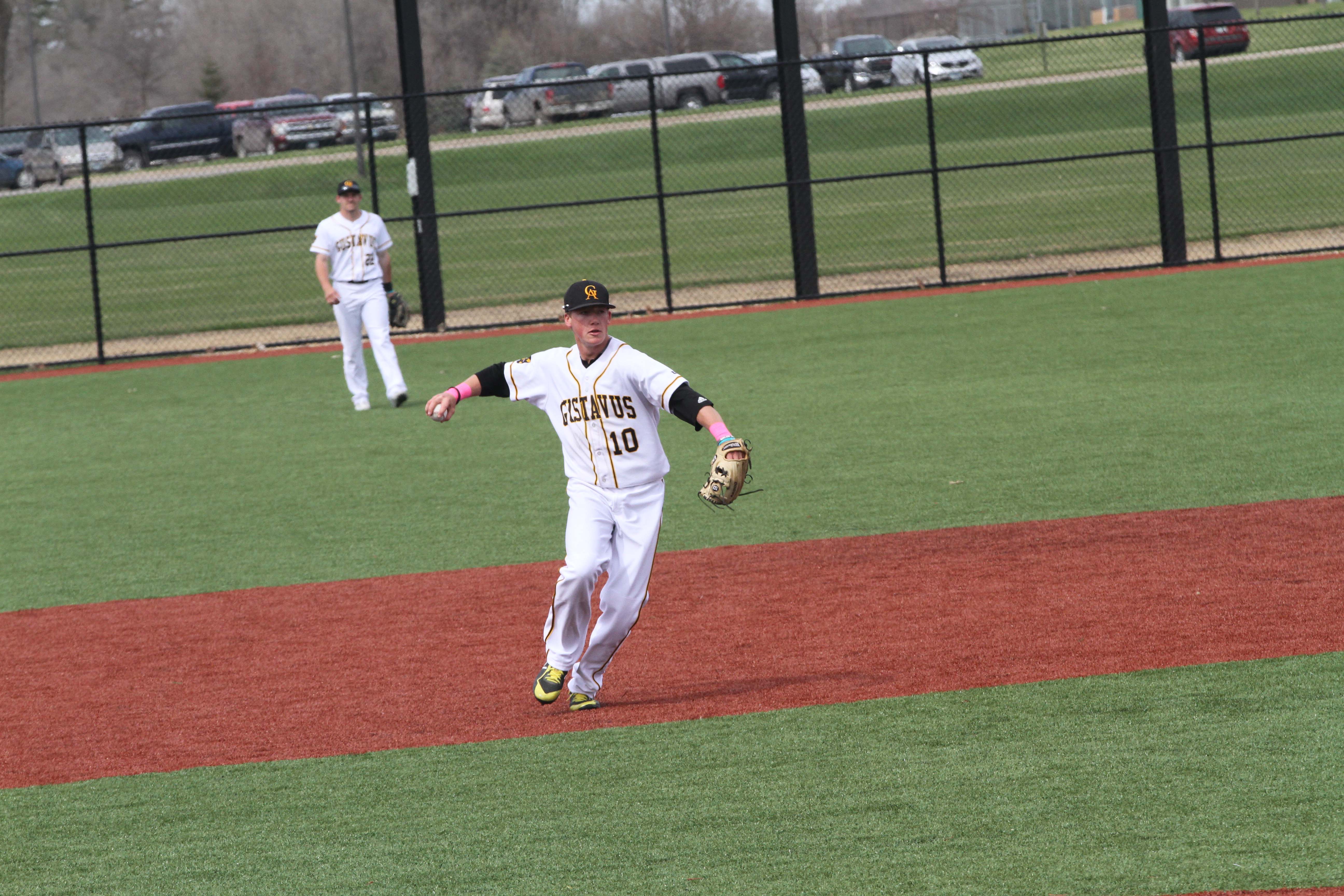 Sophomore Cole Pengilly winds up to throw a ball to first base.
