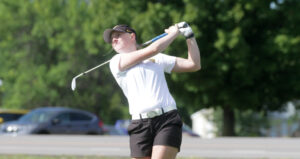 Sophomore Emily Kratz shoots for the green during a match earlier this year.