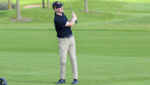 Junior Max Ullan shoots for the green at the MIAC Championships.