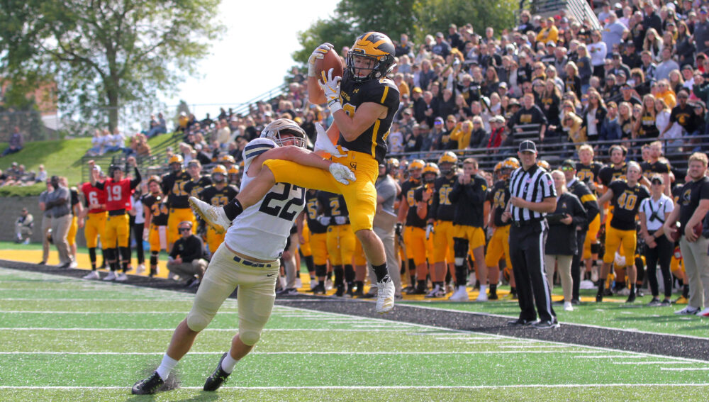 Sophmore Dalton Thelen makes a catch and scores a touchdown for the Gusties during their homecoming game against Bethel University Sept. 28.