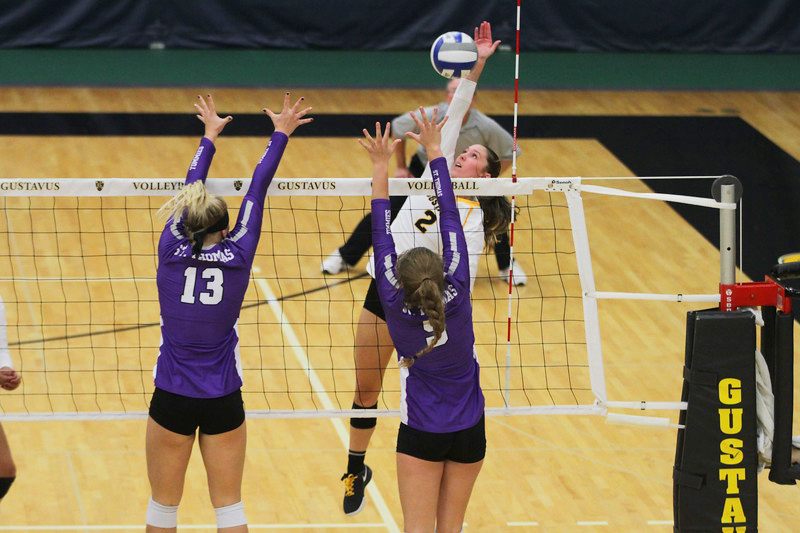 Junior Kate Holtan attempts a kill against two St. Thomas defenders. On Oct. 4, St. Thomas announced it had received an invitation to join the D1 Summit League.