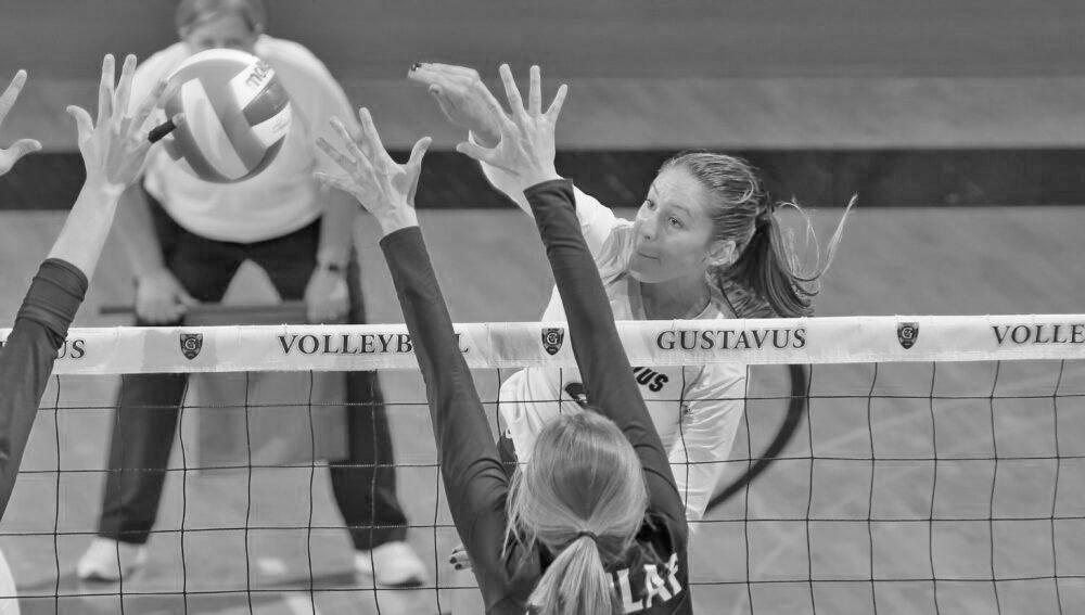 Junior Kate Holtan goes for a kill during a match against St. Olaf Sept. 26. The Gusties have split games so far this season, holding a record of 8-8.