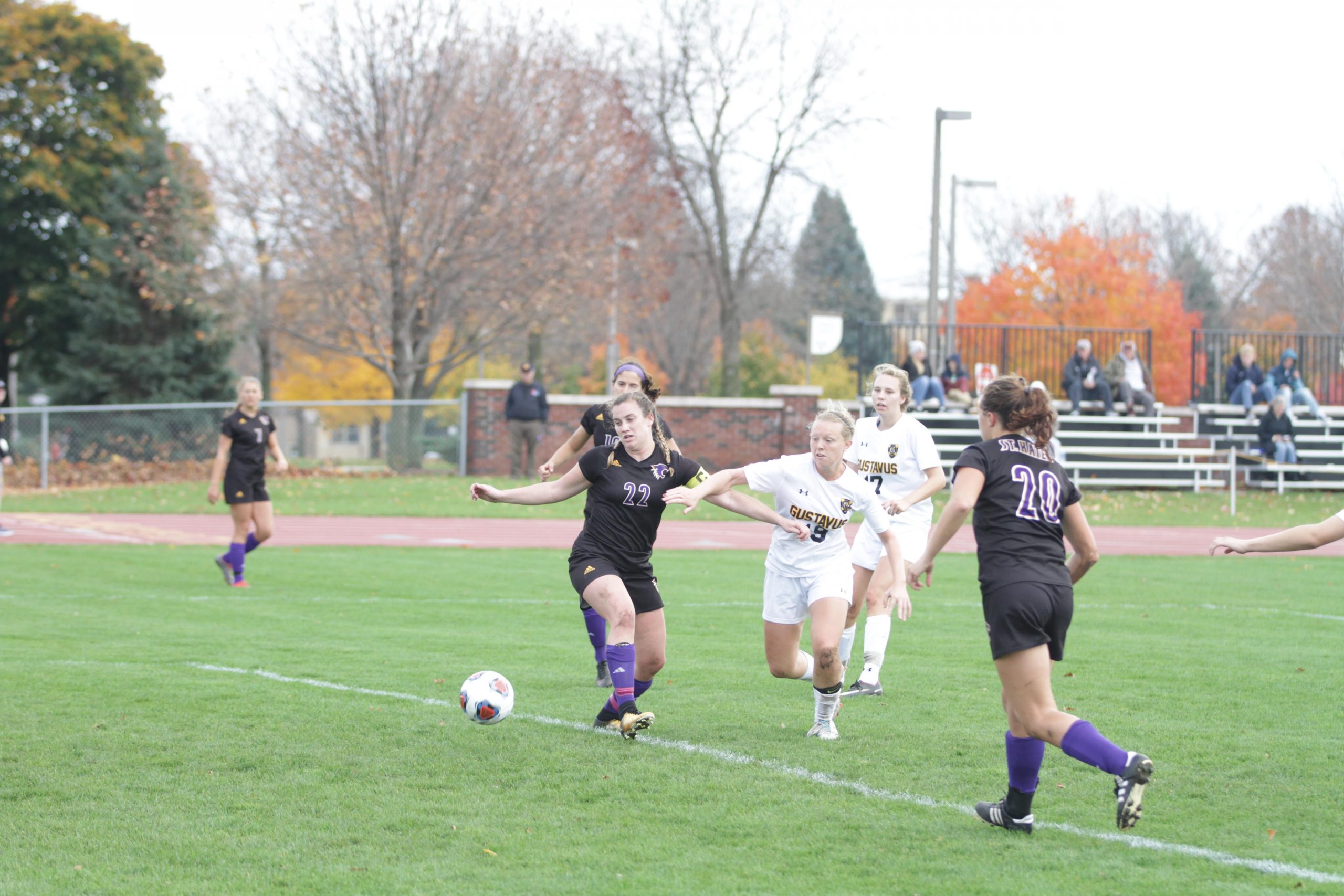 Senior Chase Miller battles for possesion of the ball during a game last season against St. Catherine University. The team started their season with a win against Redlands and a loss against Chapman.