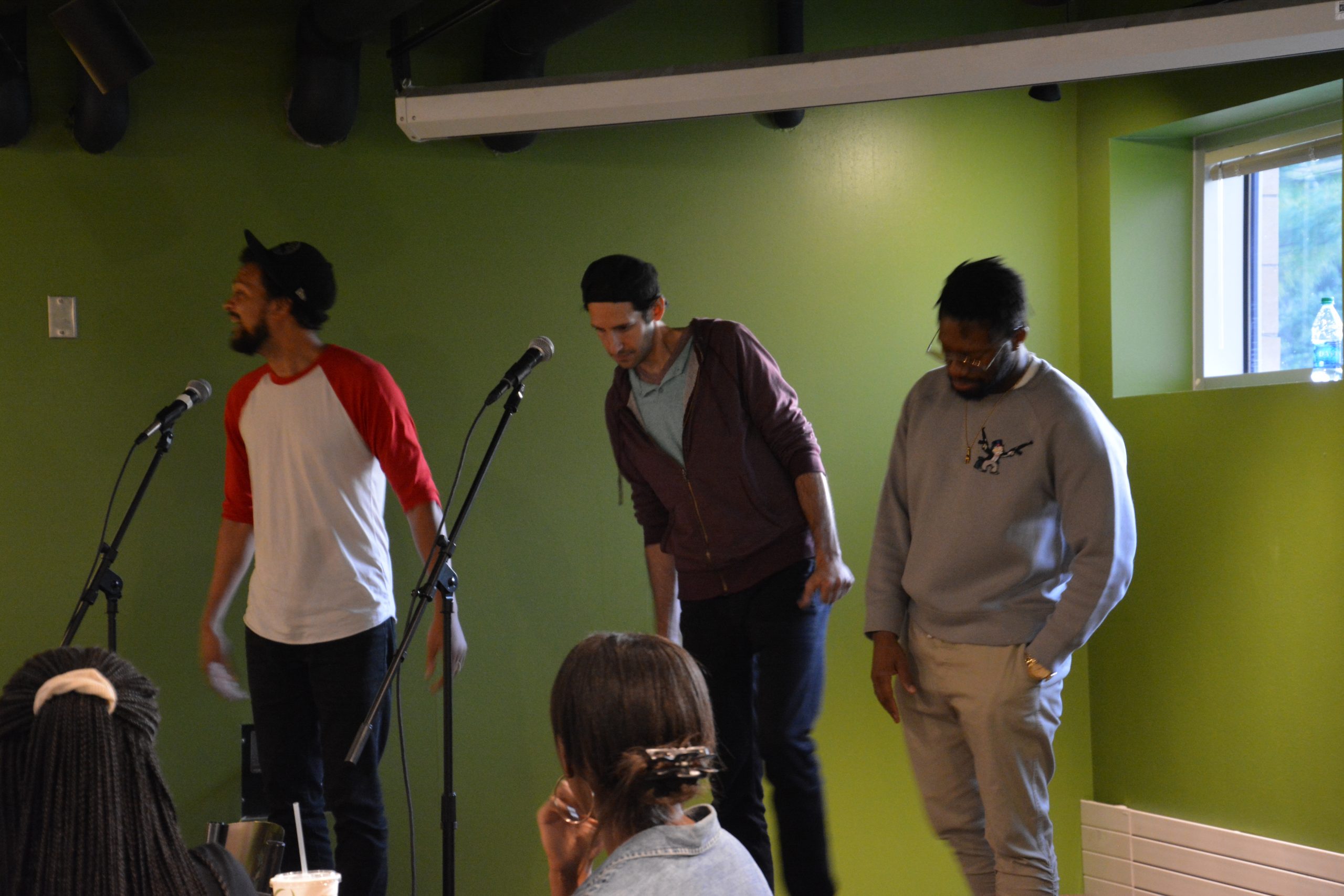 Three of the Mayhem Poets share their art and ideas in the Courtyard Cafe.