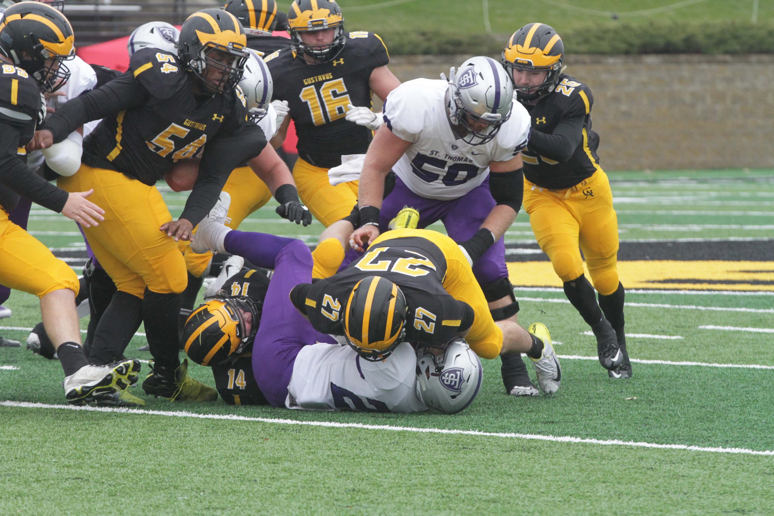 Junior Jake Boykin and Senior Matt Berkner make a tackle for the Gusties during their game against the University of St. Thomas Nov. 3.