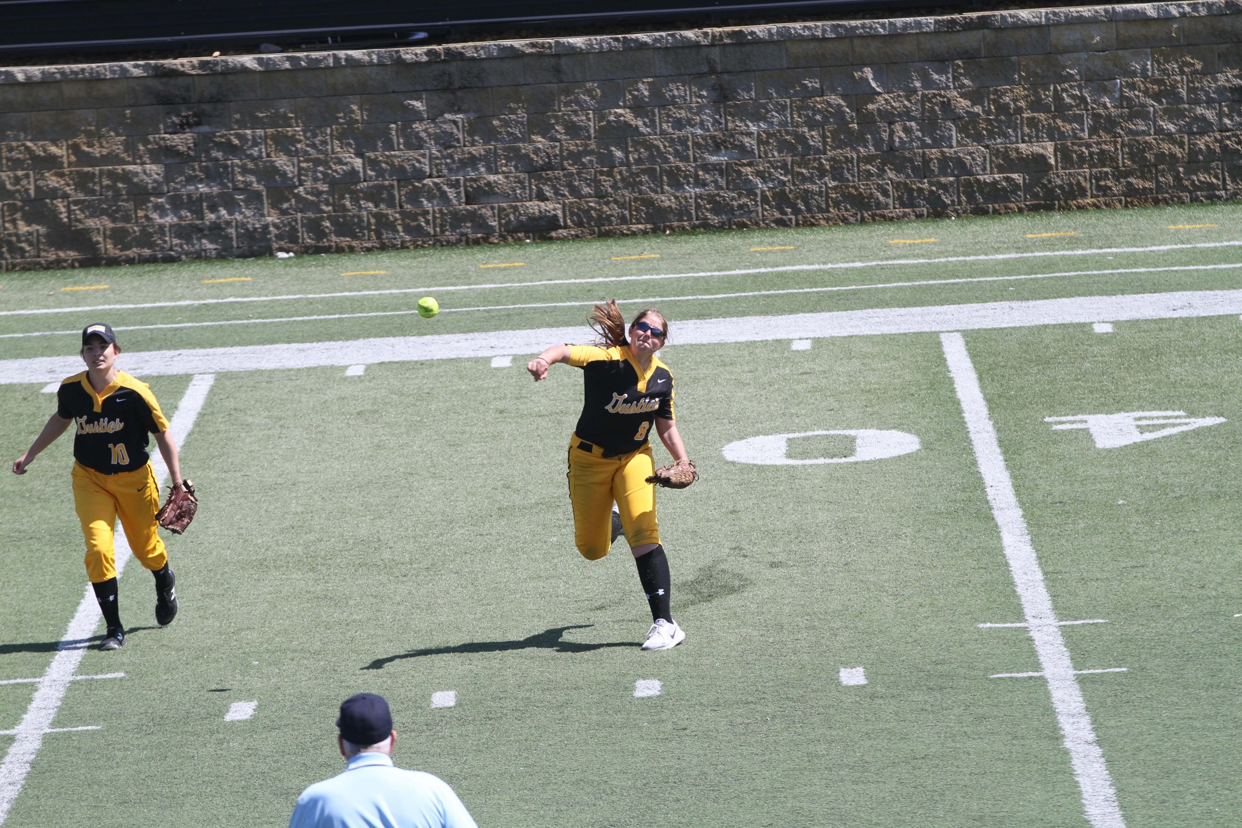 Junior Sarah Pederson fields a ball and throws it towards second base. The Gusties entered their first weekend of competition and finished with a 1-3 record.