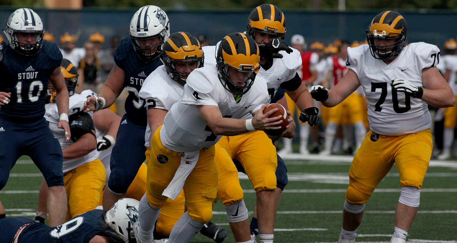 Senior Michael Veldman runs the ball into the end zone during a game against UW-Stout. The team is off to a hot 2-0 start to the season but face a big test this Saturday against No. 3 ranked St. John’s.