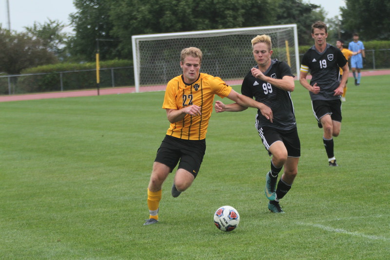 First-year Raphael Cattelin competes for the ball against a Crown defender. The team is off to a strong 4-0 start, tallying 27 goals so far while only allowing one.