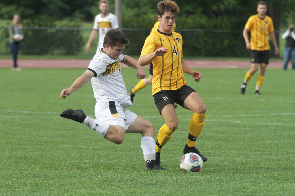 Junior Nolan Garvin prepares to block a cross from a UW-Superior midfielder. The Gusties won the game 5-1 to improve their record to 7-1 overall.