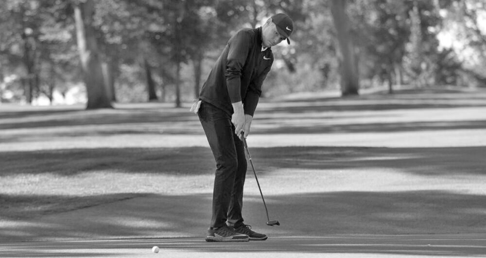 Sophomore Jacob Pedersen attempts to sink the ball during the SJU Fall Invite. Individually, Pederson finished second out of 120 golfers at the invite.