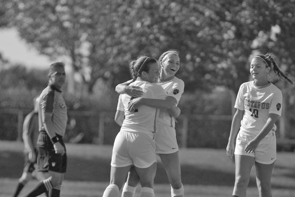 Sophomore Rachel Rehnelt and Senior Abby Mullenbach celebrate a goal during a game against Norwestern University-St. Paul.