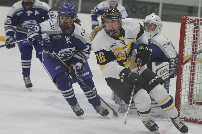 First-year Molly McHugh battles in front of the Concordia-Wisconsin net during a game Nov. 8. The team has had a perfect 3-0 start to its season.