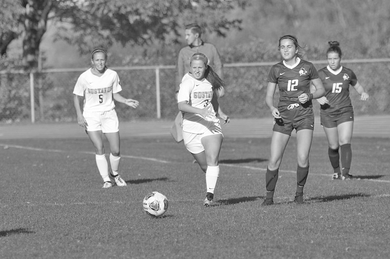 Sophomore Kenna West takes the ball upfield during a game against Carleton College Oct. 19. The Gusties will play their final game of the season Nov. 2 against Macalester College.