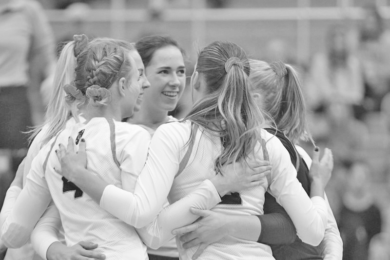 Members of the volleyball team celebrate after winning a point during a match this season. The Gusties last regular season game is Nov. 2 at 3 p.m. against St. Mary’s.