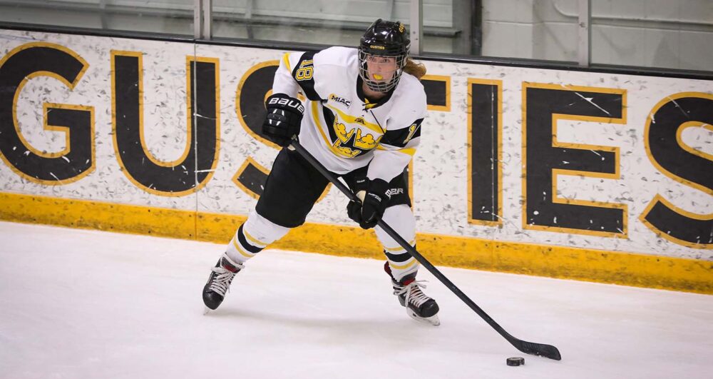 First-year Emily Olson controls the puck and looks for a pass during a game earlier this season. The Gusties most recently swept Concordia and have their sights set on playoffs.